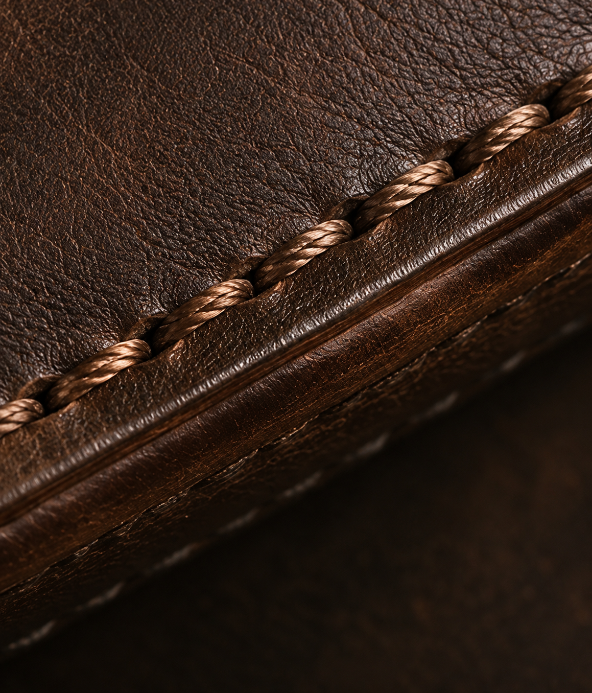 Hand-stitched leather against metal