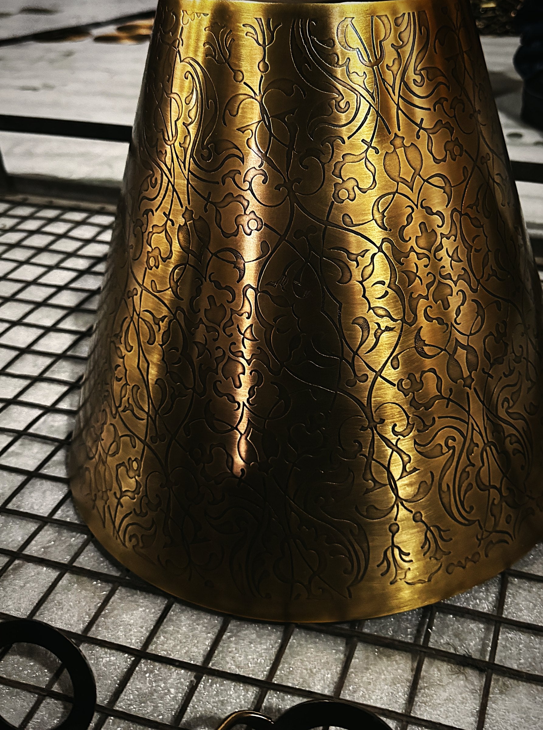 An engraved brass shade